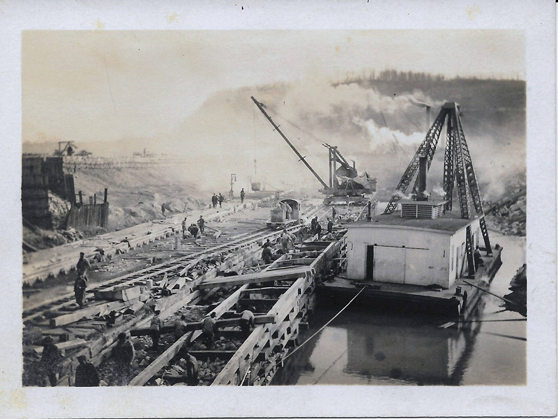 Construction of Pilcher Dam/Lock and Dam No. 43 with heavy machinery on the Ohio River c. 1914–c. 1920 (Credit: James Scott Bryant Collection via the Bobbie Smith Bryant Donation, Office of History, HQ, U.S. Army Corps of Engineers).